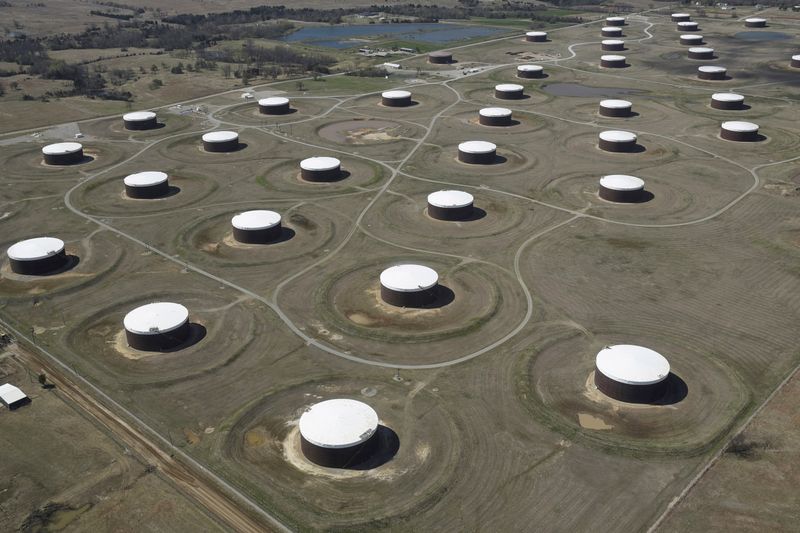 Crude oil storage tanks are seen from above at the
