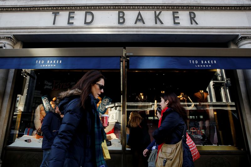 FILE PHOTO: Shoppers walk past a Ted Baker store on