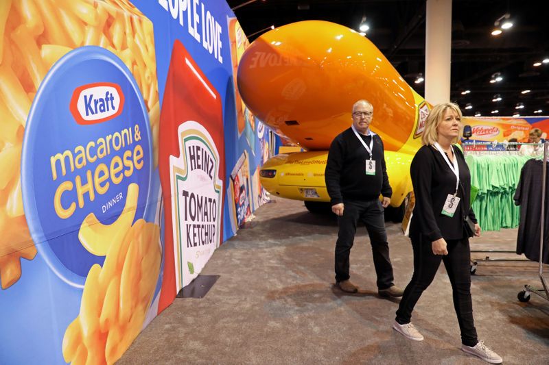 Shareholders shop for discounted products at the Kraft Heinz booth