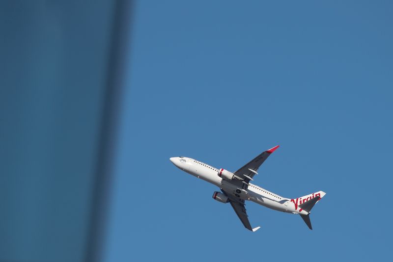 A Virgin Australia Airlines plane takes off from Kingsford Smith