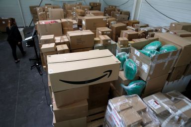 An employee prepares an order for Amazon at Porona warehouse