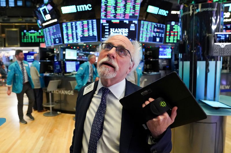 FILE PHOTO: Trader works at the New York Stock Exchange