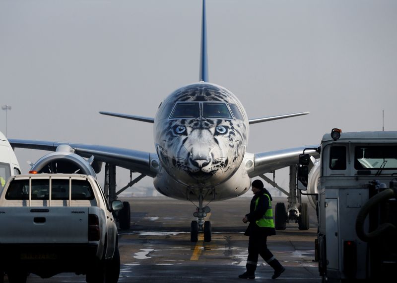 Air Astana Embraer E190-E2 aircraft with a snow leopard livery