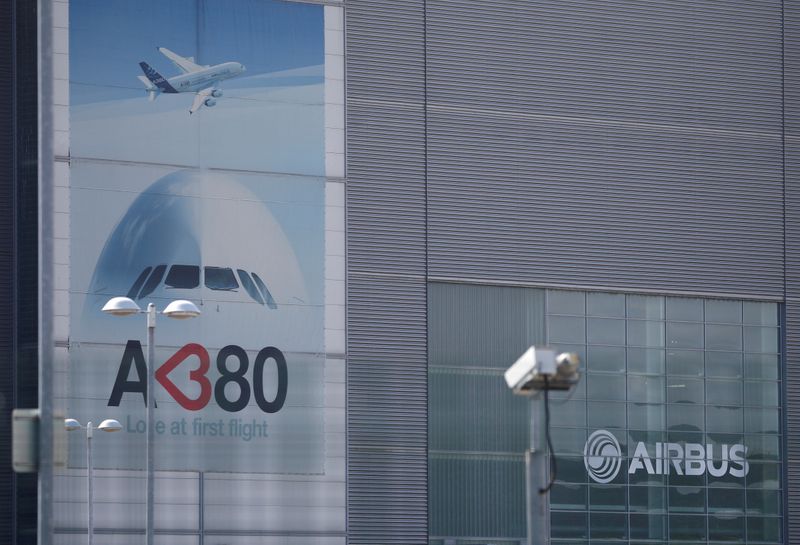 FILE PHOTO: Branded posters are seen at Airbus’ wing assembly