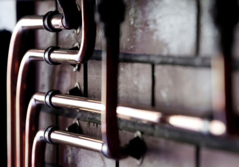 FILE PHOTO: Copper pipes are pictured during a double distillation