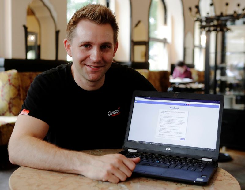 FILE PHOTO: Austrian lawyer and privacy activist Schrems displays his