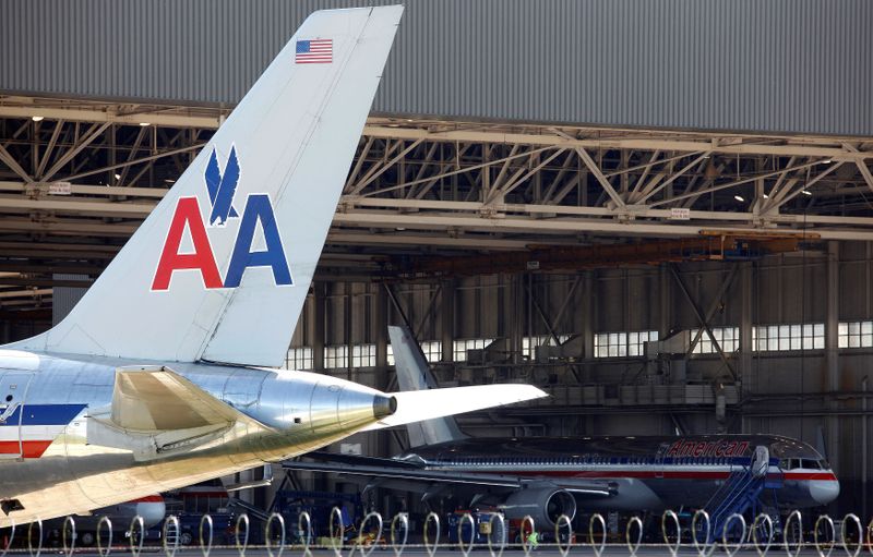 FILE PHOTO: An American Airlines airliner sits near a hanger