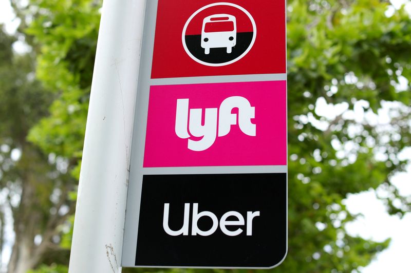 FILE PHOTO: A sign marks a rendezvous location for Lyft