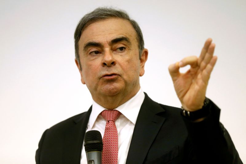 Former Nissan chairman Carlos Ghosn gestures during a news conference