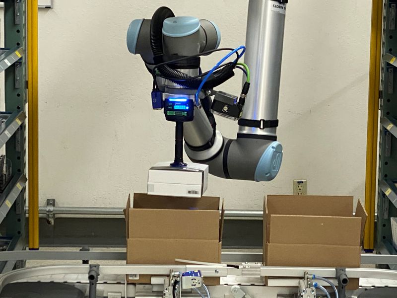 A collaborative robot, or cobot, places an item in a