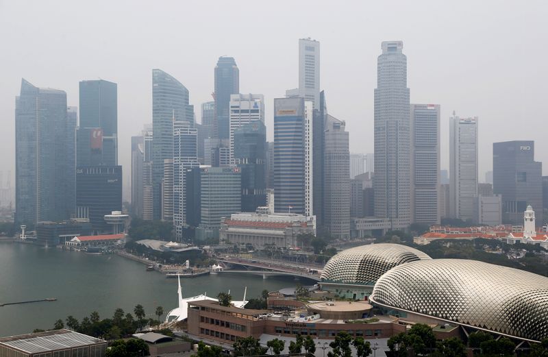 FILE PHOTO: The financial district is seen shrouded by haze