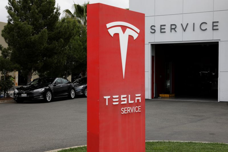 A Tesla service center is shown in Costa Mesa, California