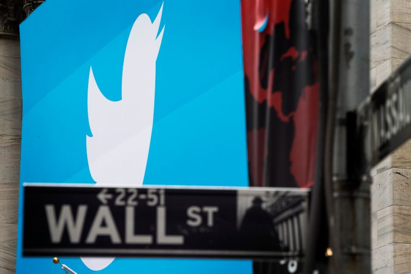 A sign displays the Twitter logo on the front of