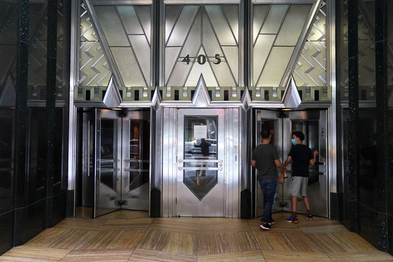 Men walk into the Chrysler building in the Manhattan borough