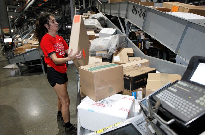 United Parcel Service employees sort packages at the UPS Worldport