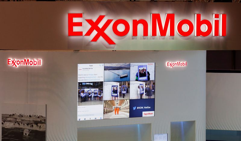 FILE PHOTO: Logos of ExxonMobil are seen in its booth