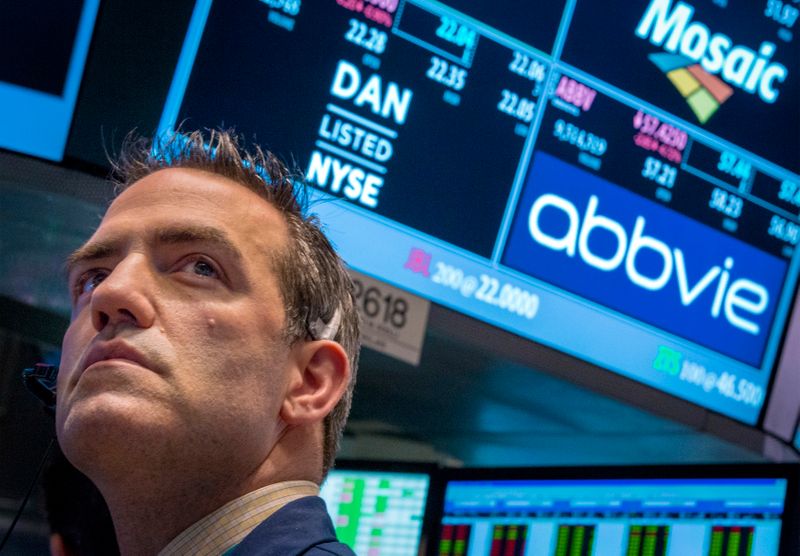 A trader works by the post that trades AbbVie on