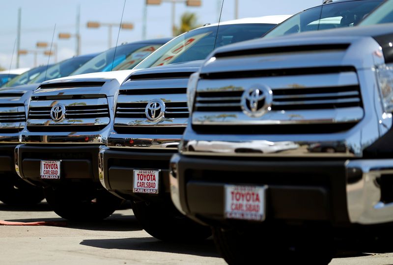 Toyota trucks are shown for sale at a dealership in