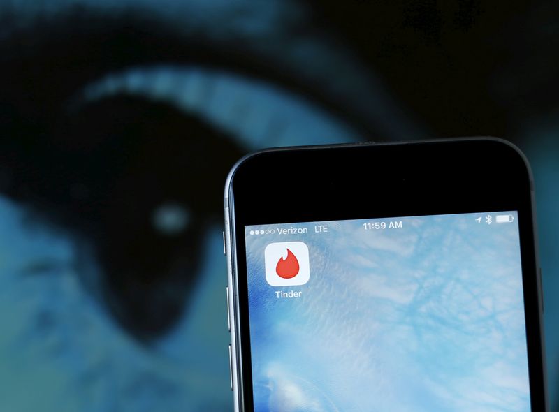 Photo illustration of dating app Tinder shown on an Apple