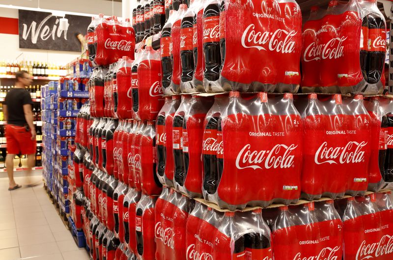 Bottles of Coca-Cola are displayed at a supermarket of Swiss