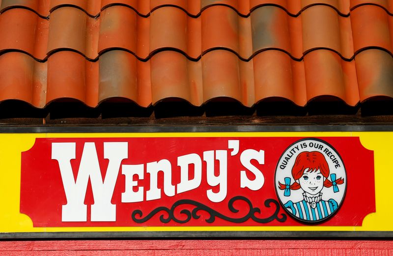 A Wendy’s sign and logo are shown at one of