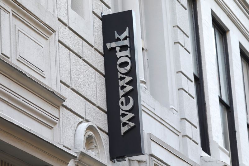 A sign is seen above the entrance to the WeWork