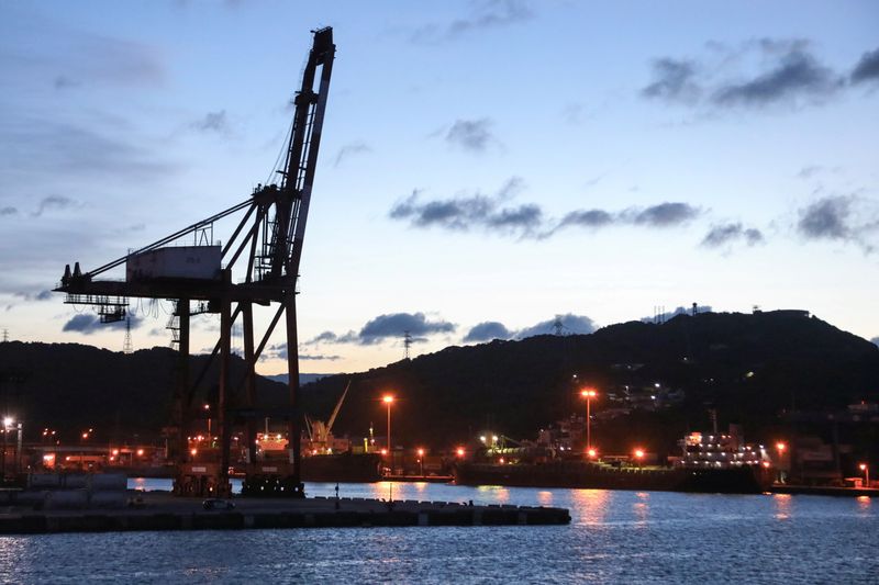 Cargo cranes are seen at Keelung Port during sunset hour