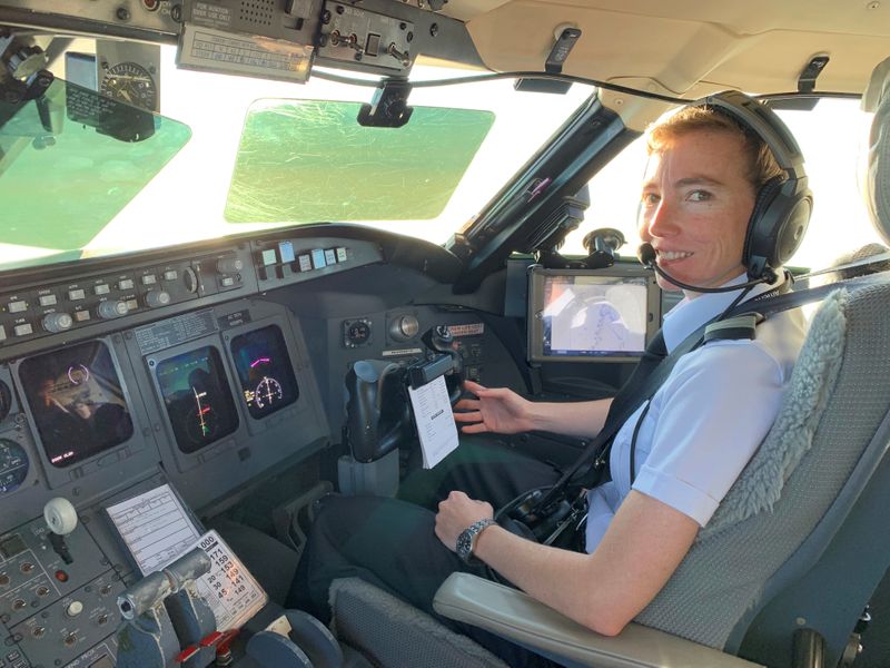 PSA pilot Megyn Thompson in the cockpit of a Bombardier
