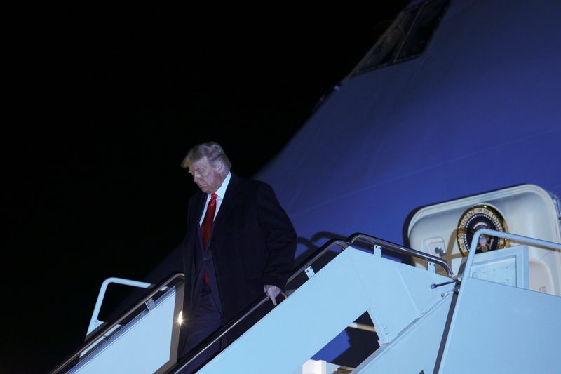 U.S. President Donald Trump descends from Air Force One following