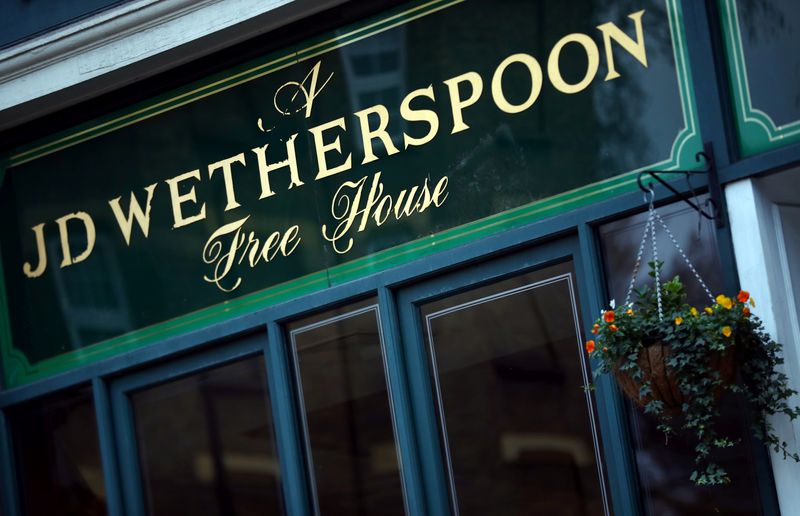 FILE PHOTO: A Wetherspoon’s logo is seen at a pub