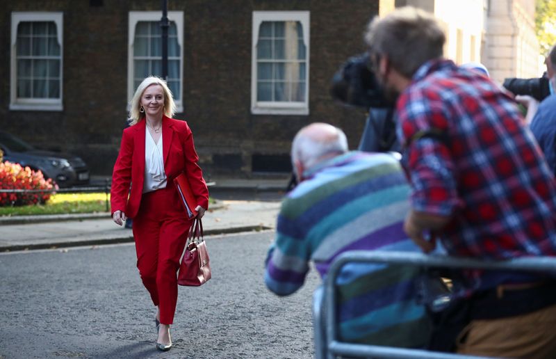 Britain’s International Trade Secretary Liz Truss walks outside Downing Street