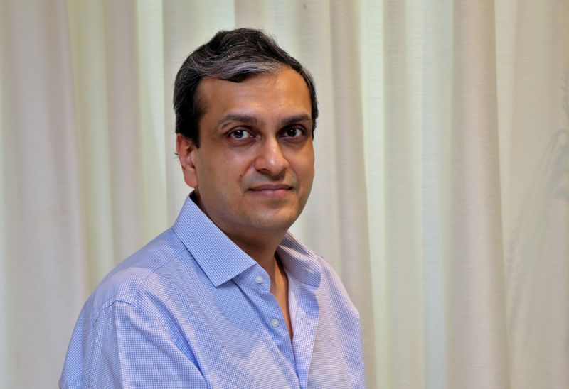 Madhur Deora poses for a photograph inside his house in