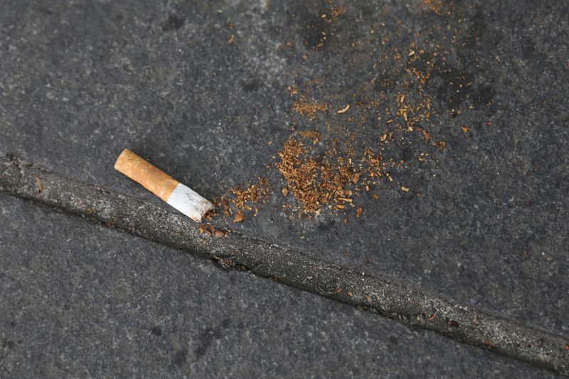FILE PHOTO: A cigarette butt lies on a street in