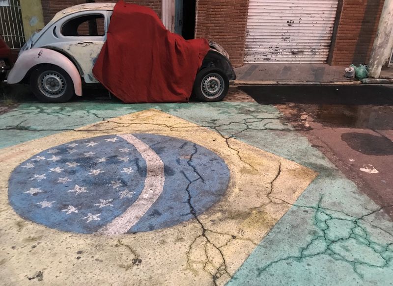 A Brazilian flag is seen painted on a street in