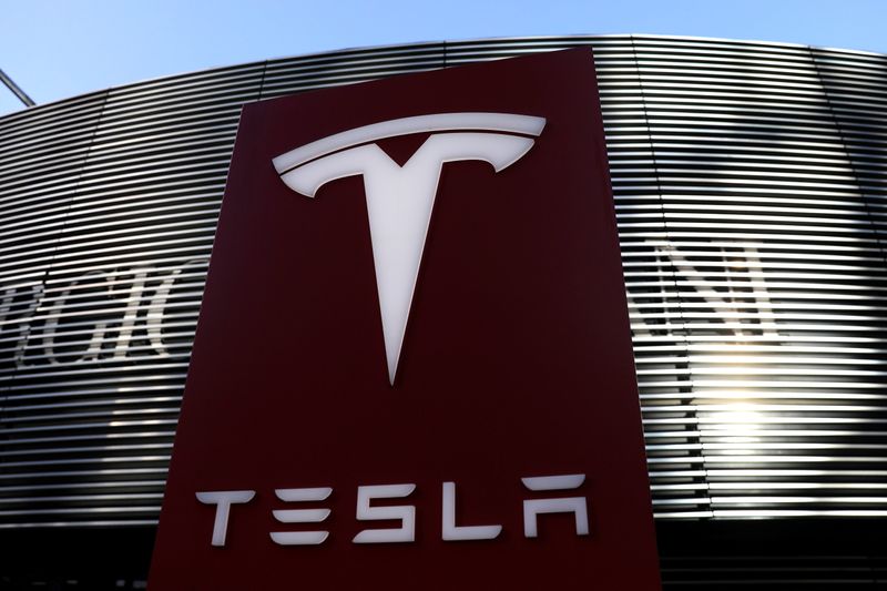 Logo of the electric vehicle maker Tesla is seen near