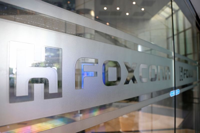 FILE PHOTO: Sign of Foxconn is seen at a glass