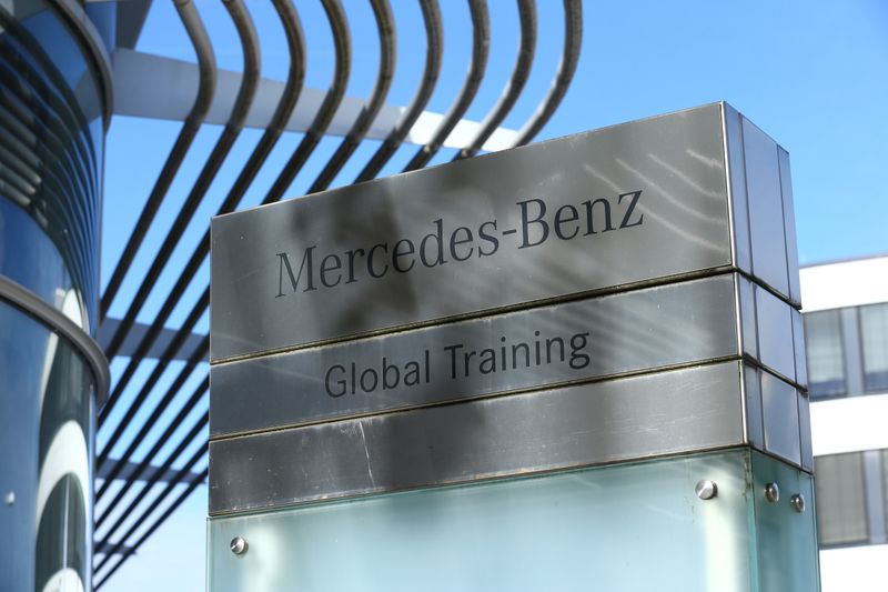 Mercedes-Benz logo is seen while activists from the anti-globalisation organisation