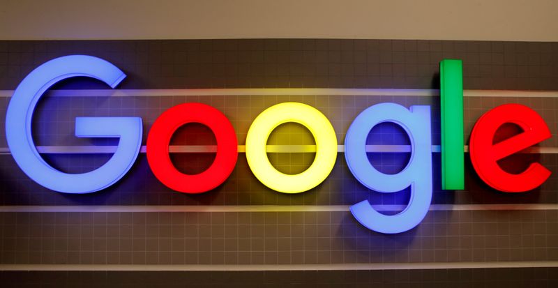 FILE PHOTO: An illuminated Google logo is seen inside an