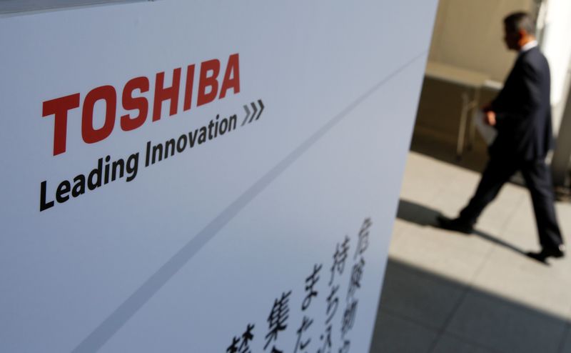 The logo of Toshiba is seen as a shareholder arrives