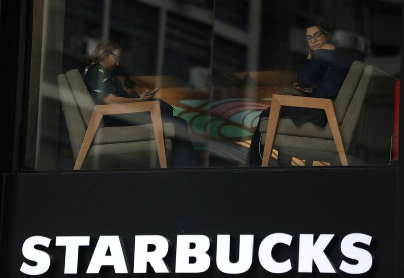 FILE PHOTO: Customers sit inside a Starbucks coffee shop in