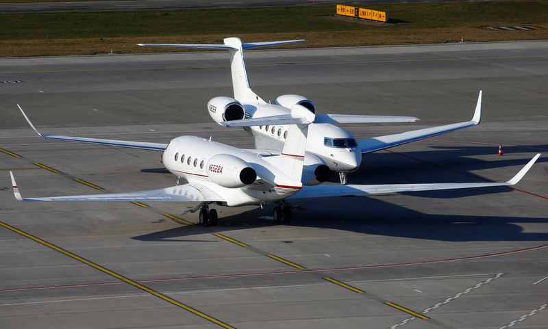 Two Gulfstream GVI G650 GLF6 business aircrafts are parked at