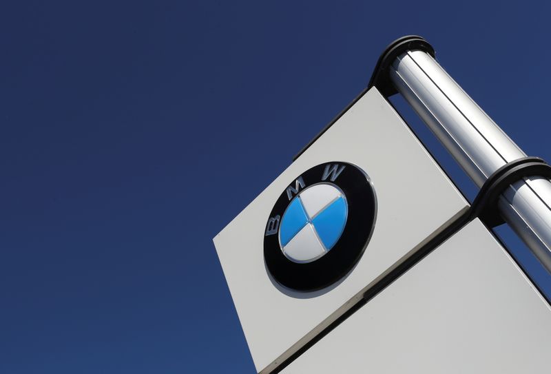 A logo of BMW is seen outside a BMW car