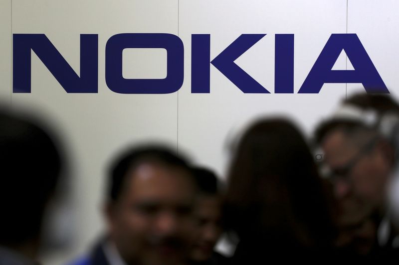 FILE PHOTO: Visitors gather outside the Nokia booth at the