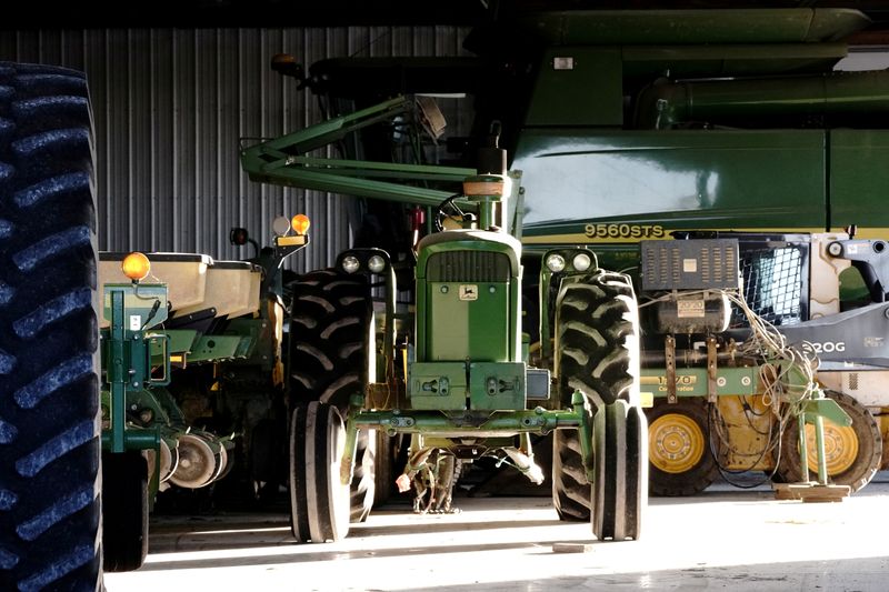 FILE PHOTO: A John Deere tractor, a combine, and other