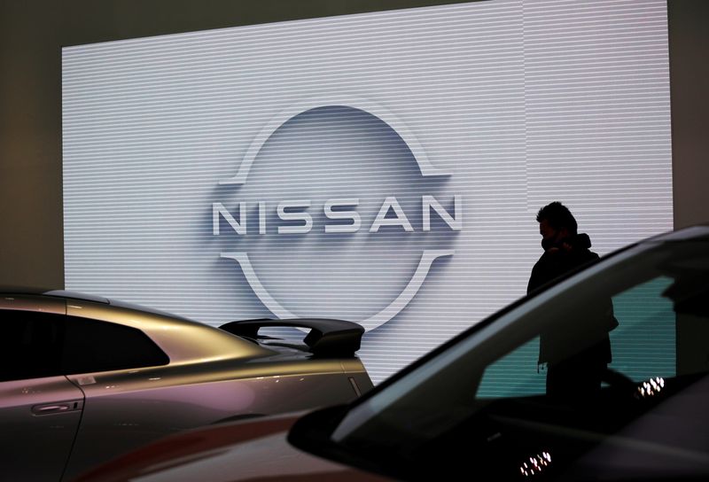 A visitor is seen at Nissan Motor Corp.’s showroom in