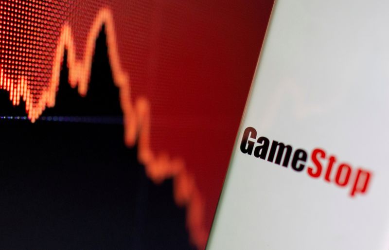 FILE PHOTO: GameStop logo is seen near displayed stock graph