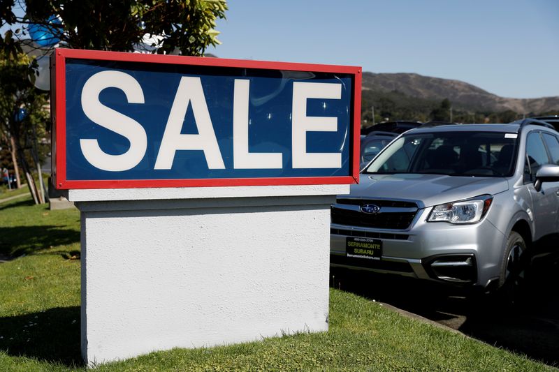 FILE PHOTO: A sale sign is seen at car dealer