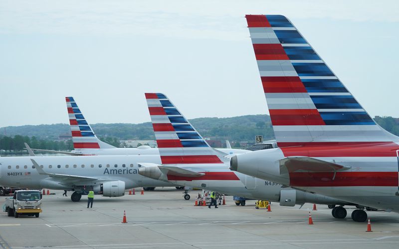 American Airlines jets sit at gates at Washington’s Reagan National