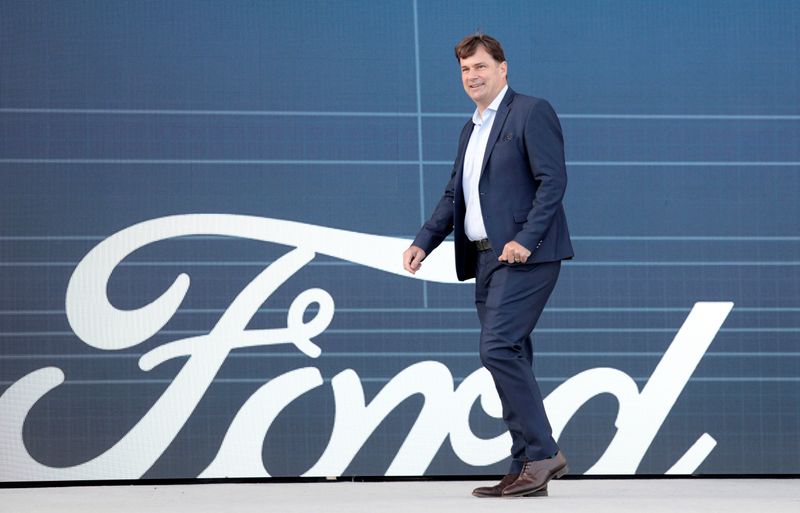Ford Motor Co. CEO Jim Farley walks to speak at