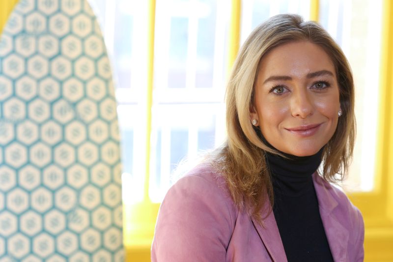 FILE PHOTO: Bumble founder and CEO Whitney Wolfe Herd sits
